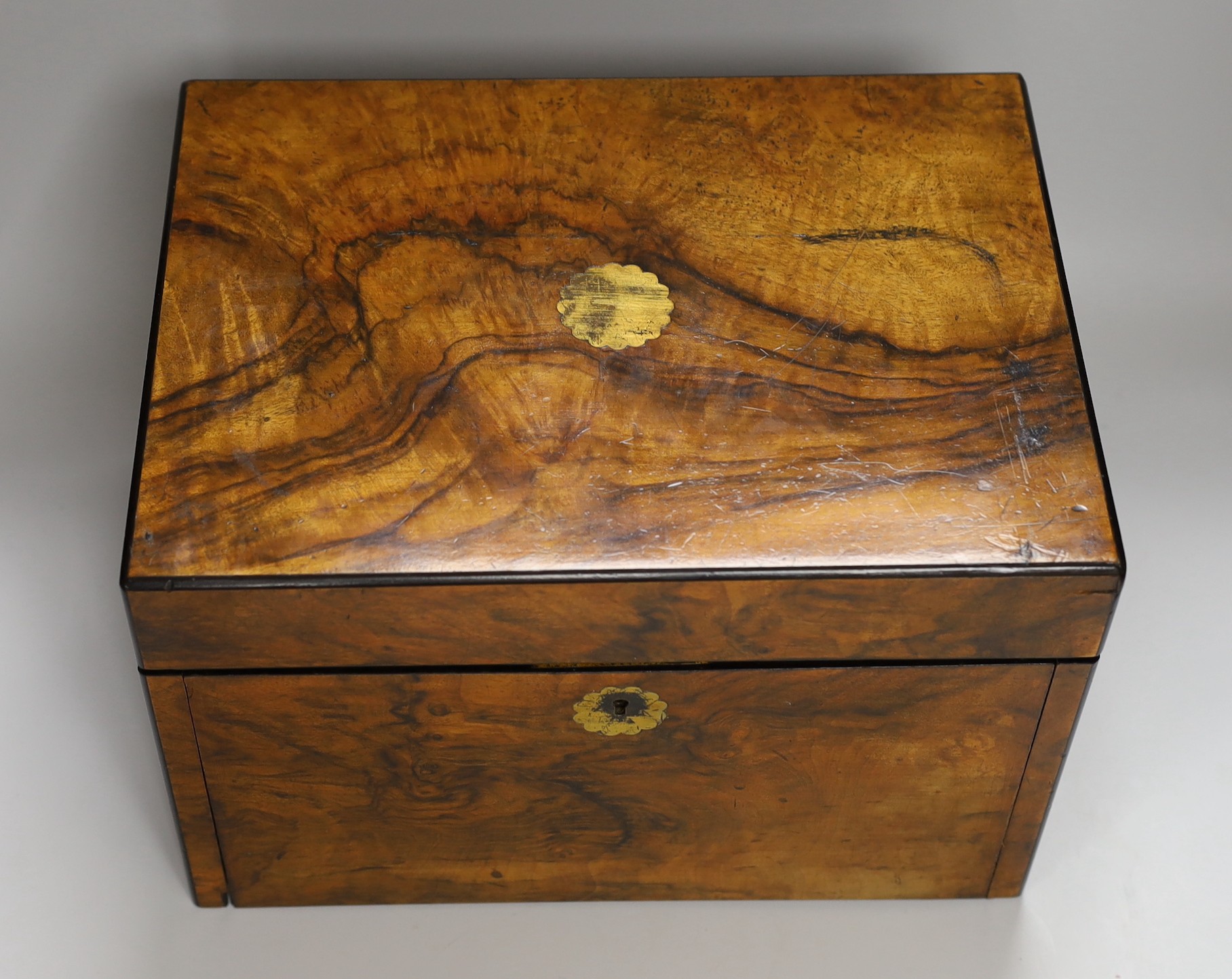 A Victorian walnut sewing casket with concealed spring loaded writing slope, 33.5cms wide x 23cms high